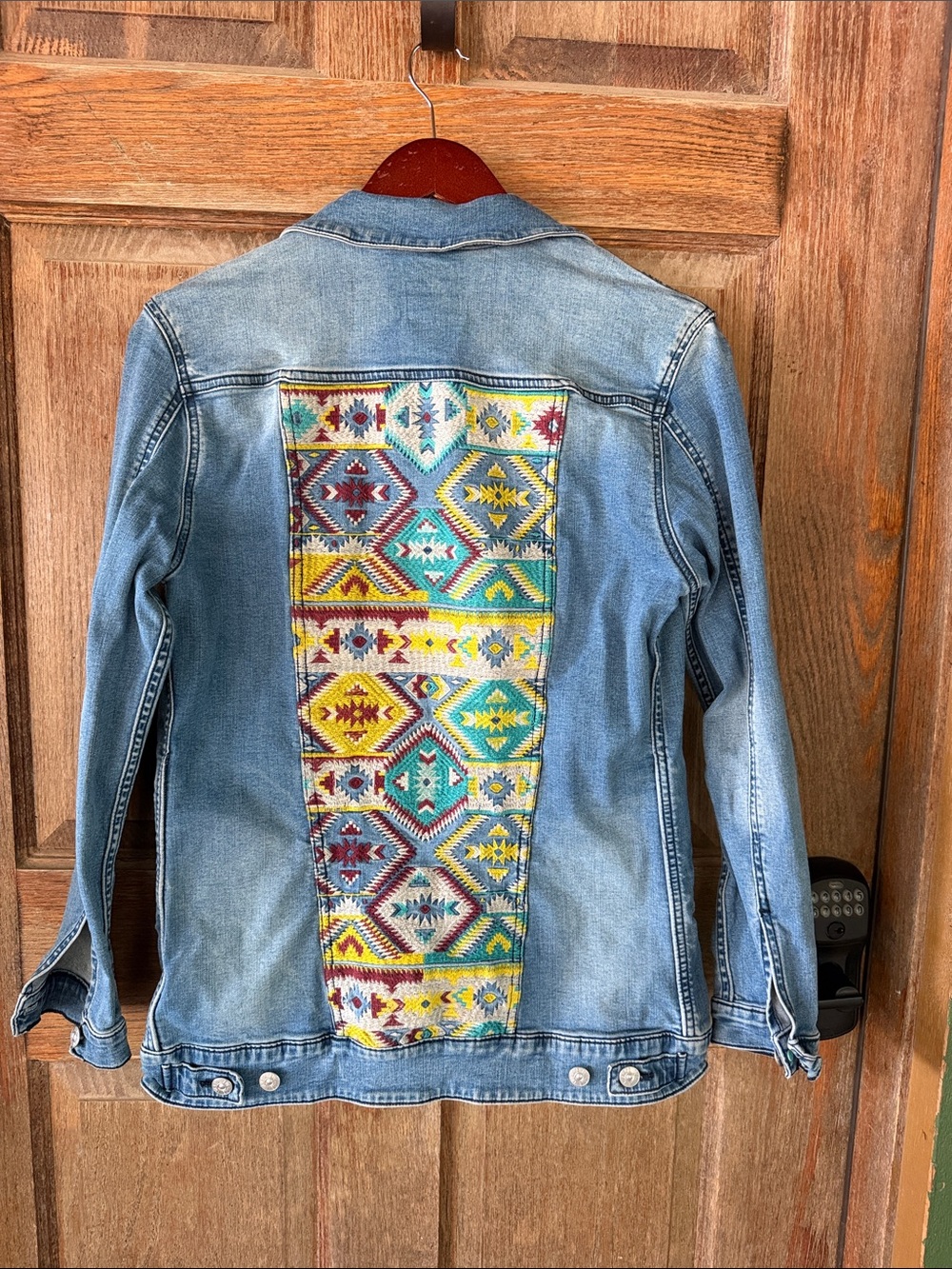 LuLaRoe Light Wash Denim Jacket with Multicolor Embroidered Panel